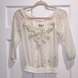 Sheer top w/ floral appliqué